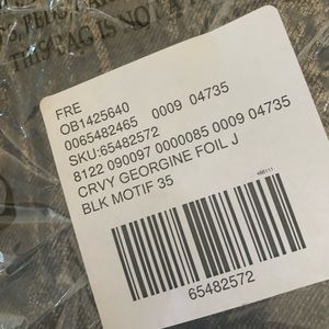 Jenas/pants with gold and black leopard like print.